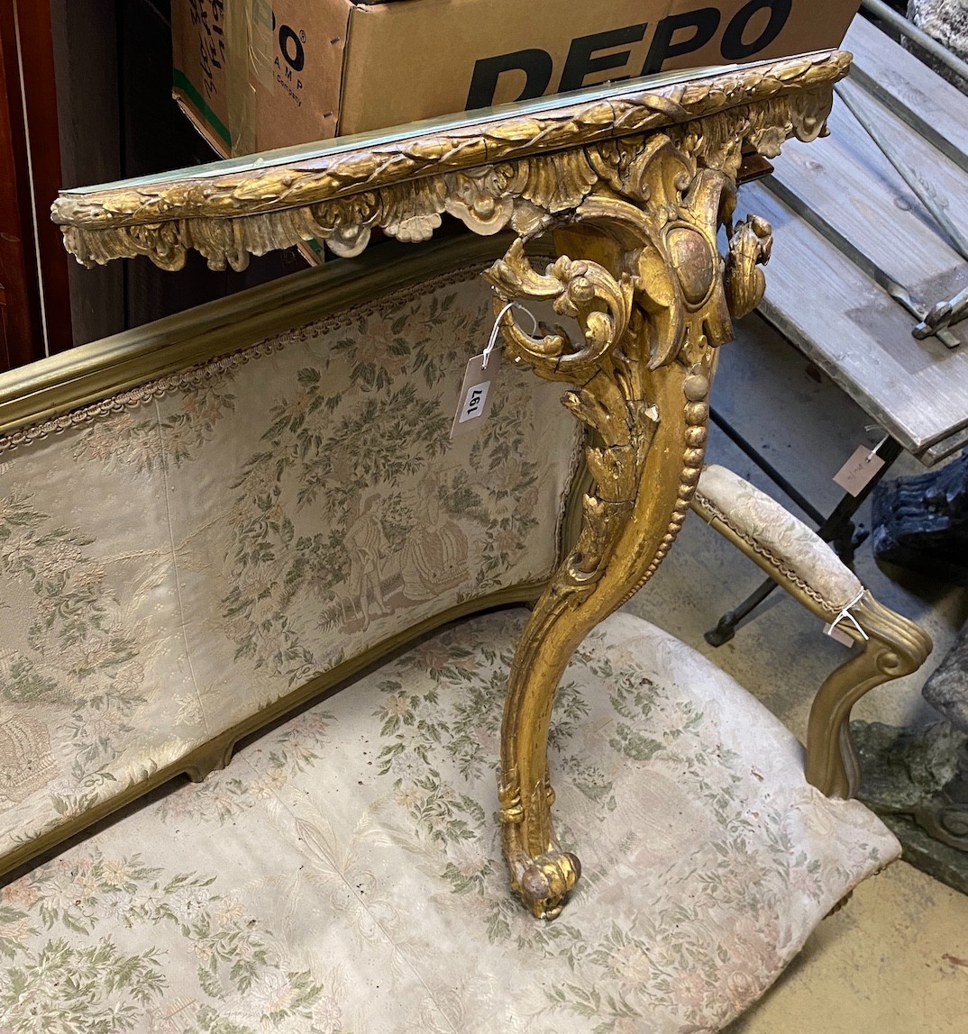 A Victorian giltwood and composition console table, with later faux onyx top, width 62cms, depth 32cms, height 86cms. Please note that the gilt moulding has been damaged.
